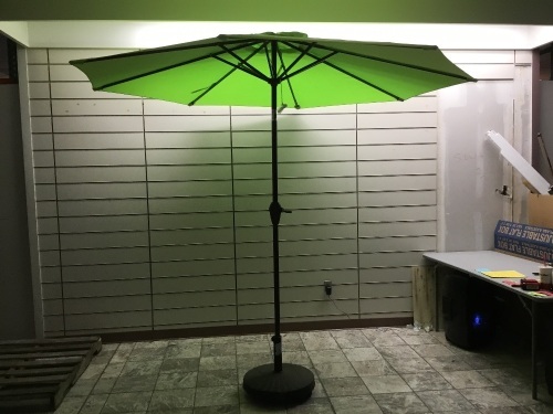 Lime Green Patio Umbrella & Base w/ Crank/Tilt Feature. Tested/Works. Appears New.  - Lot 431