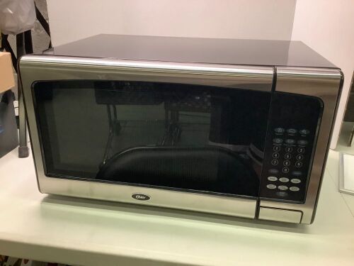 Oster 1.1 Cu Ft. Countertop Microwave Oven, Appears New - Lot 25
