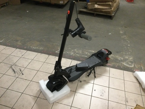 Large Electric Scooter. Has Charger. Cannot get it to power on. Appears unused though - Lot 291