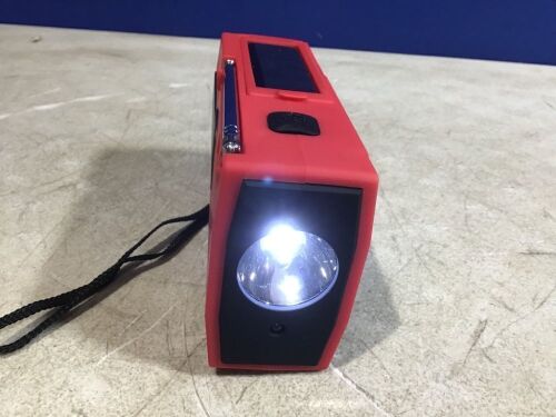 Case of (21) Solar Crank Radio w/ Flashlight and Reading Lamp. - Lot 442