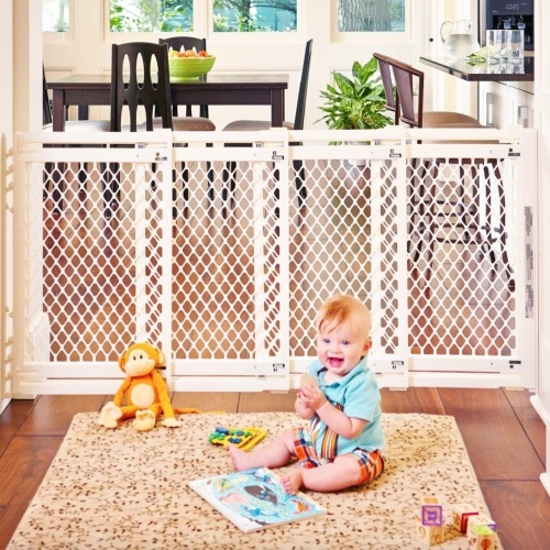 Toddleroo by North States 62" wide Extra Wide Baby Gate: Smoothly opens and closes in extra wide spaces. Hardware Mount. Fits 22" - 62" wide (31" Tall, Ivory). Appears New - Lot 657