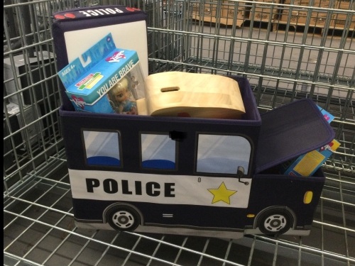 Police toy box with toys appears new - Lot 141