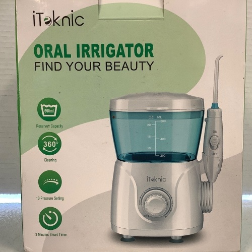 iTeknic Oral Irrigator, Powers Up, Appears New - Lot 762