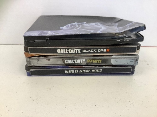 Lot of 4 Damaged PS4 Steelbook Games, Shadow of War, Call of Duty Black Ops III, Call of Duty WWII, and Marvel VS. Capcom: Infinite, E-Commerce Return, Untested - Lot 110