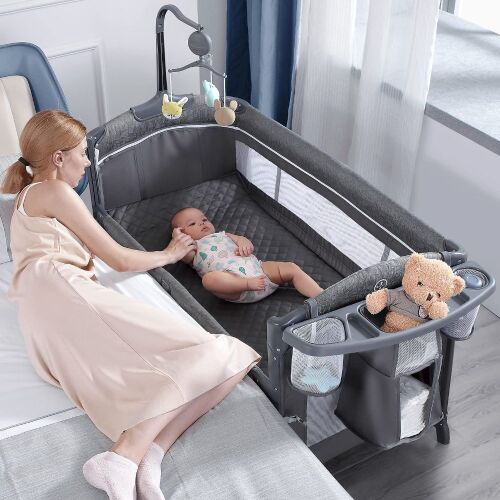 BabyBond Baby Bassinet Bedside Crib, Pack and Play with Sheet, Diaper Changing Table and Music Mobile  - Lot 97