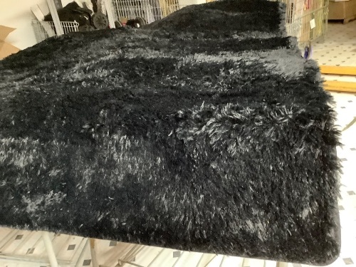 Black area rug with non skid backing- 112" x 75" - Lot 99