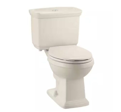 Glacier Bay 12 inch Rough In Two-Piece 1.0 GPF/1.28 GPF Dual Flush Elongated Toilet in Bone Seat Included  - Lot 90