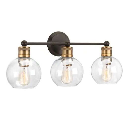 Hansford Collection 24.5 in. Vintage Electric 3-Light Antique Bronze Coastal Farmhouse Clear Glass Bathroom Vanity Light  - Lot 544
