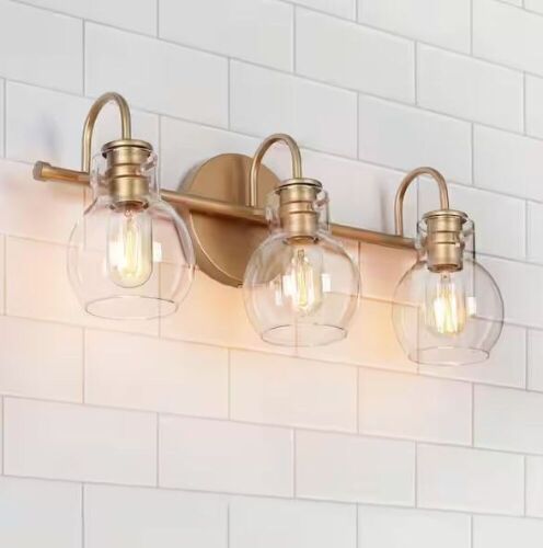 LNC Robb Modern 3-Light Gold Bathroom Vanity Light with Clear Globe Shades - Lot 809
