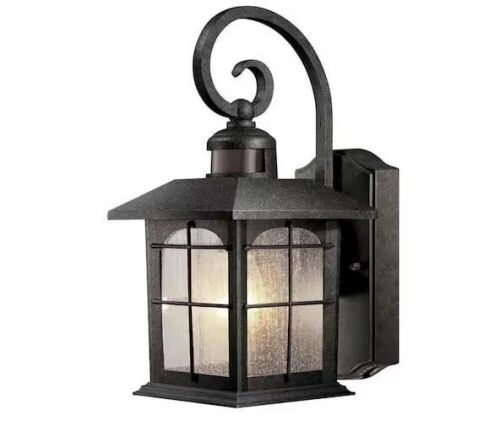 Home Decorators Collection Brimfield Motion-Sensing 14.2 in. Aged Iron 1-Light Line Voltage Outdoor Wall Light Sconce  - Lot 295
