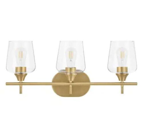 Hampton Bay Pavlen 24 in. 3-Lights Antique Brass Vanity Light with Clear Glass Shades - Lot 492