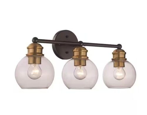 Bel Air Lighting Polverini 23 in. 3-Light Black and Antique Gold Bathroom Vanity Light Fixture with Clear Glass Shades - Lot 462