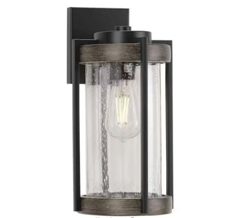 Progress Lighting Whitmire 1-Light Matte Black with Aged Oak Accents Clear Seeded Glass Farmhouse Outdoor Wall Lantern Sconce - Lot 656