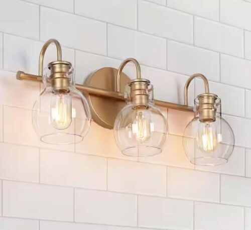 LNC Robb Modern 3-Light Gold Bathroom Vanity Light Interior Powder Room Lighting with Clear Globe Shades - Lot 454