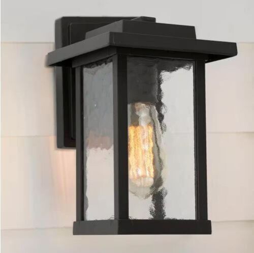 LNC 1-Light Black Modern Farmhouse Outdoor Wall Lantern Sconce with Water Glass Shade - Lot 412