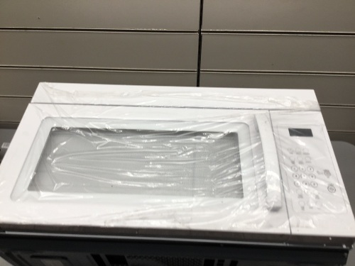 White Microwave Hood Combination. Appears New With Dent on Side. Tested - Lot 656