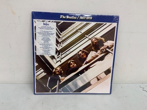 The Beatles Record, 25 Classic Tracks, Appears New - Lot 446