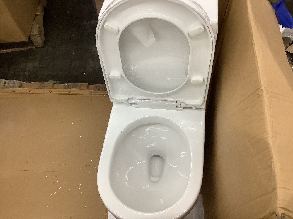 One-Piece 1.1/1.6 GPF Dual Flush Round Toilet in White Soft Close Seat - No Install Kit (Cap Covers, Wax Ring, Instructions) - Image 4 - Lot 68JF