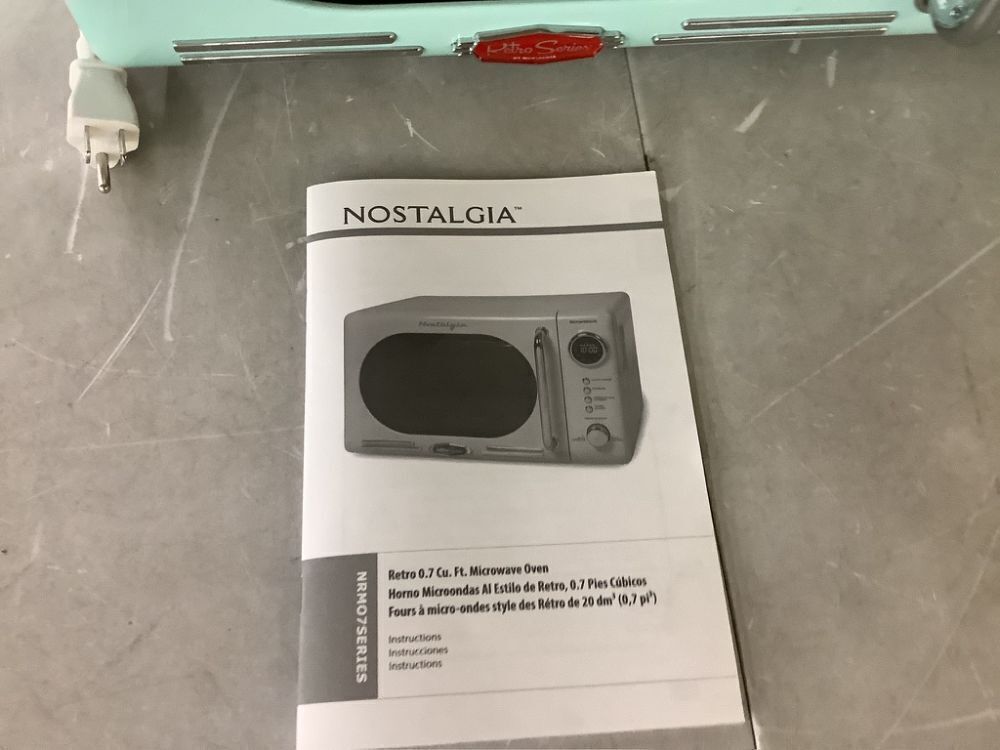 Nostalgia Retro 0.7 cu. ft. 700-Watt Countertop Microwave Oven in Aqua - Image 2 - Lot 465JF