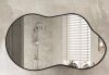 Irregular Black Aluminum Alloy Framed Wall Mirror, 46 in. W x 26 in. H - Thumbnail 1