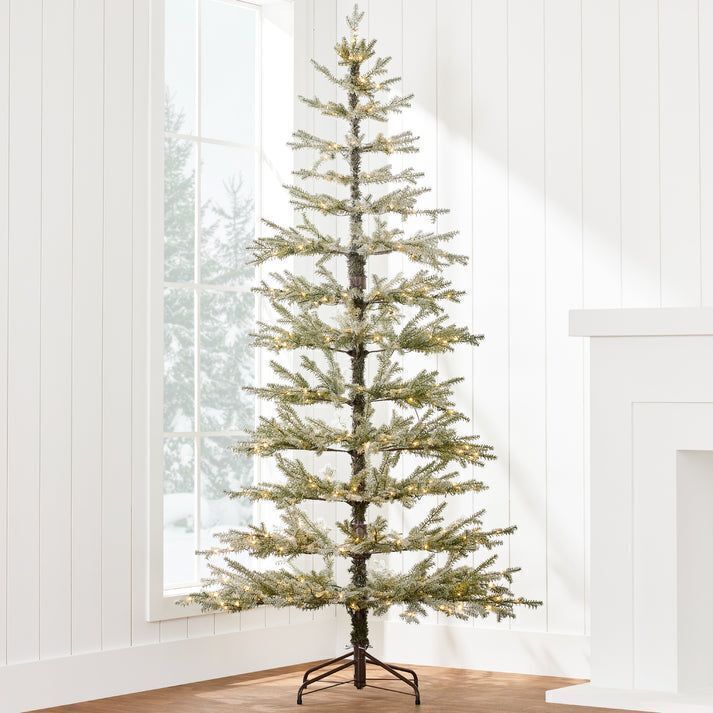 4.5' Green Pre-Lit Sparse Flocked Christmas Tree w/ 2-in-1 LEDs, Cordless Connection - Image 1 - Lot 245