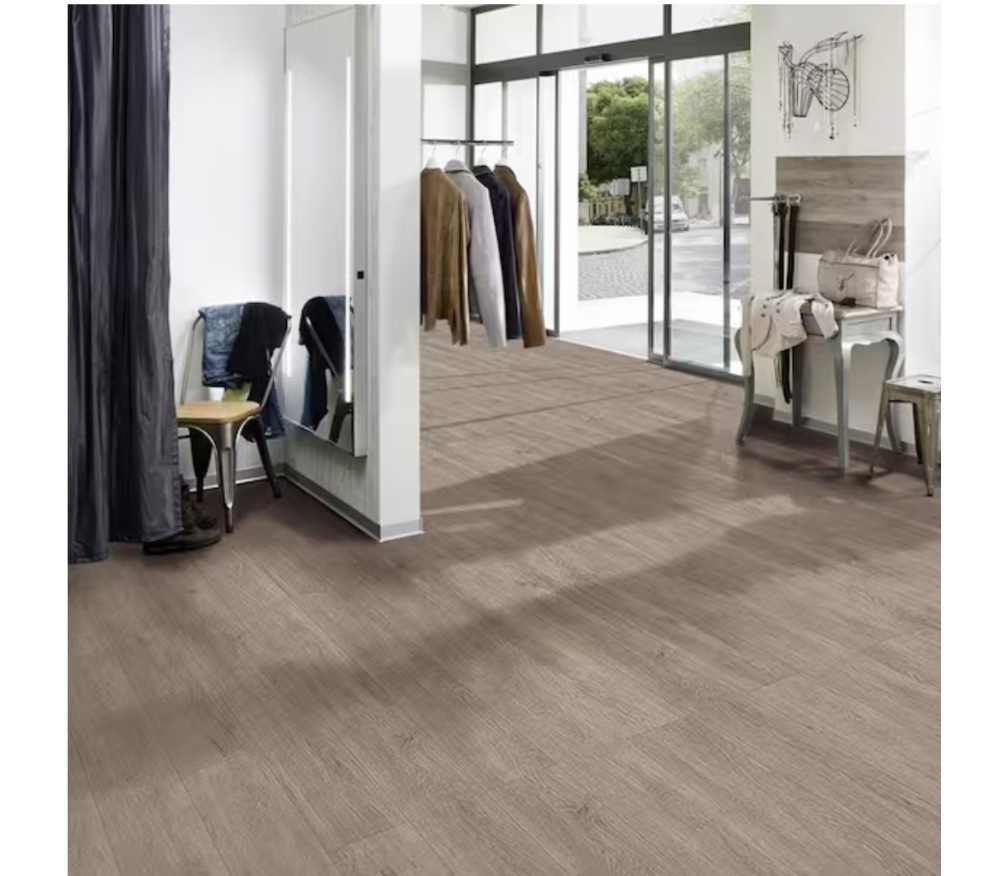 1,764 sq. ft. - (49) Cases of TrafficMaster Taupe Oak 4 MIL x 6 in. W x 36 in. L Peel and Stick Water Resistant Luxury Vinyl Plank Flooring (36 sqft/case) - Image 1 - Lot 8JF
