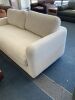 Cream sofa under storage - Thumbnail 1