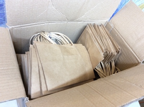 (1) Box, 150 Count, Brown Handled Paper Retail/Party/Shopping Bags. 5.5 x 5.1 x 8.2". Appears New.  - Lot 347