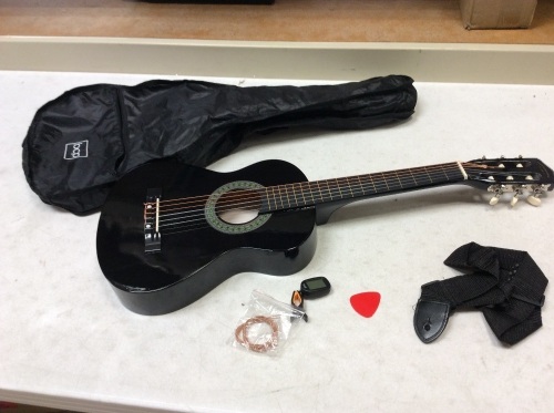 Black Guitar With Strings, Tuner, Pick, Strap, and Case. Some Damage. E-Commerce Return. See Pictures - Lot 883