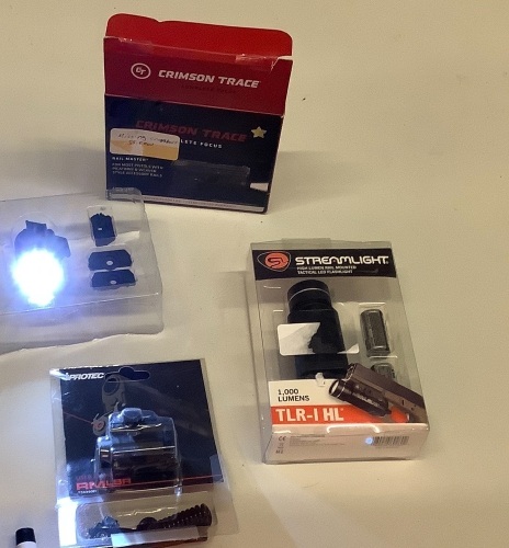 Lot of (3)  1 Streamlight 1000 lumen rail mounted tactical flashlight, 1 Crimson Trace CMR-2009 Rail Master, 1 Iprotec laser site. - Lot 97