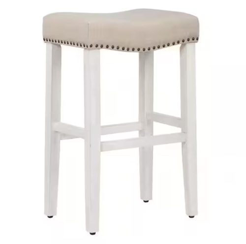 Westinfurniture Jameson 29 in. Bar Height Antique White Wood Backless Nailhead Trim Barstool with Upholstered Beige Linen Saddle Seat
