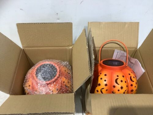 Lot of (2) Outdoor Solar Hanging Pumpkin Lanterns with Moon & Star Cutouts  - Lot 140